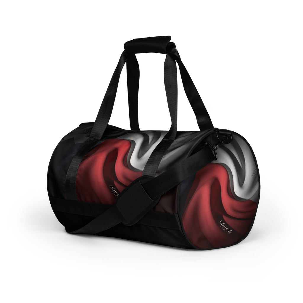 Duffle bag with black, red, and white design on a white background at Oatmeal Apparel Co.