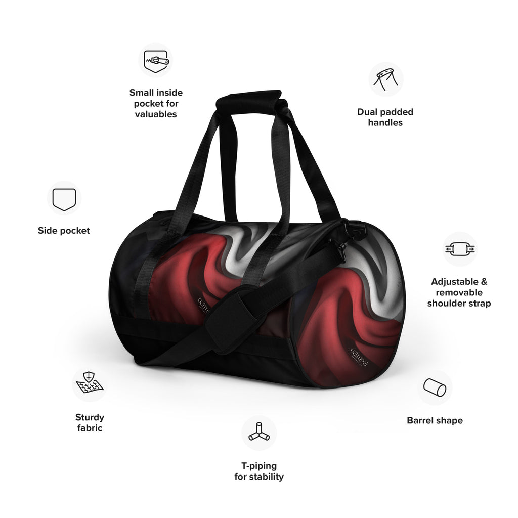 Black duffel bag with custom red and gray design, featuring various compartments and features on a white background at Oatmeal Apparel Co.