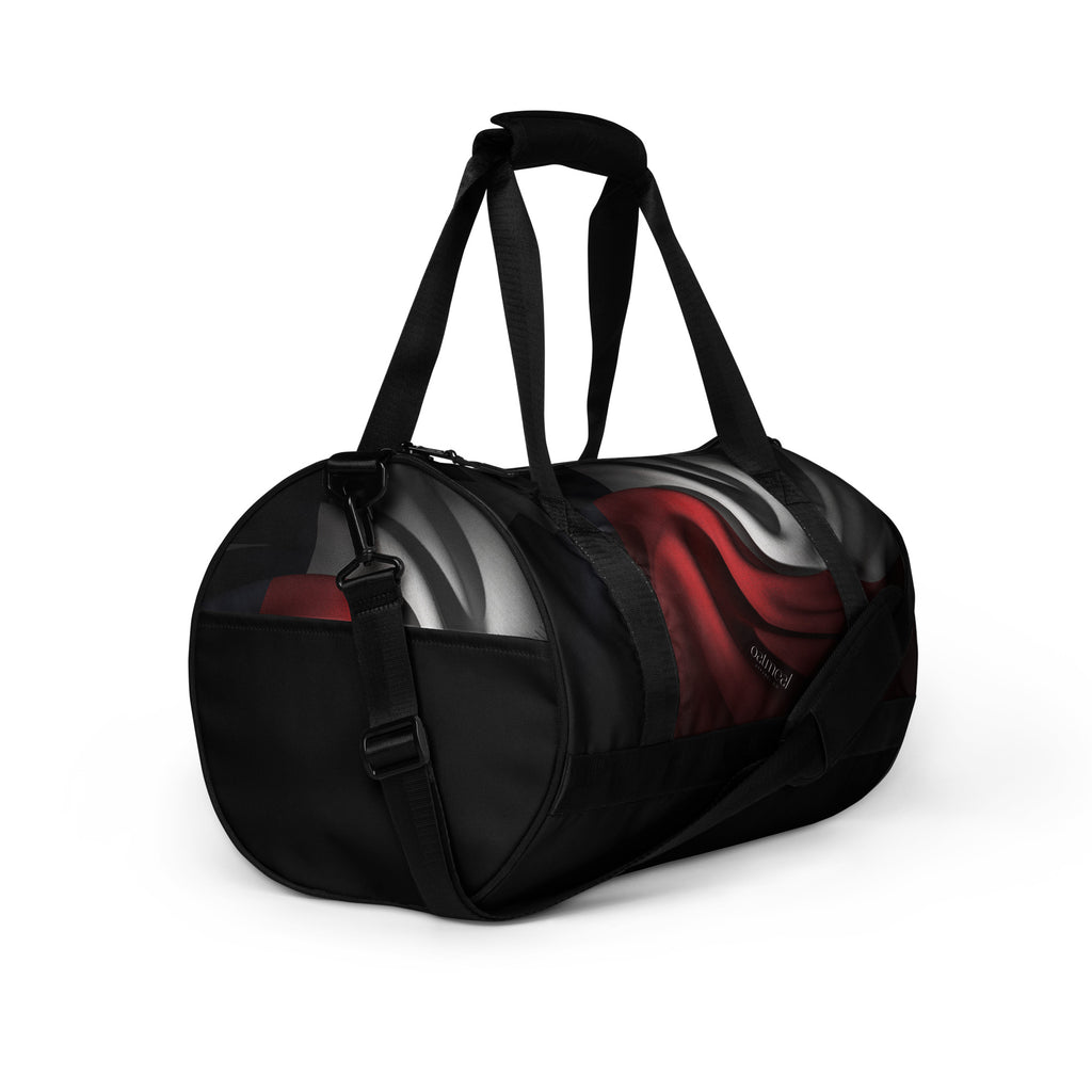 Black duffel bag with a red and white design on a white background at Oatmeal Apparel Co.