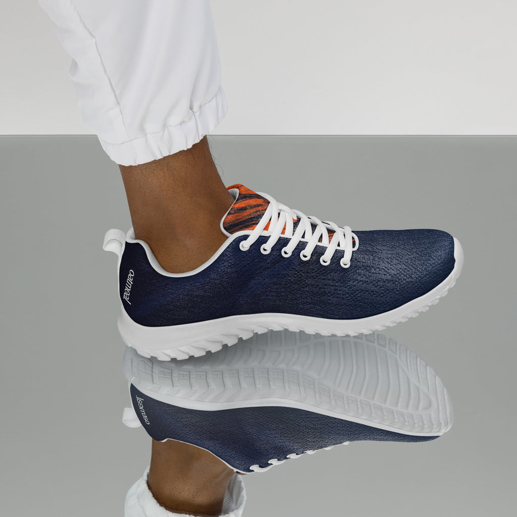 Navy blue sneakers with white soles worn by a person on a mirror background at Oatmeal Apparel Co.
