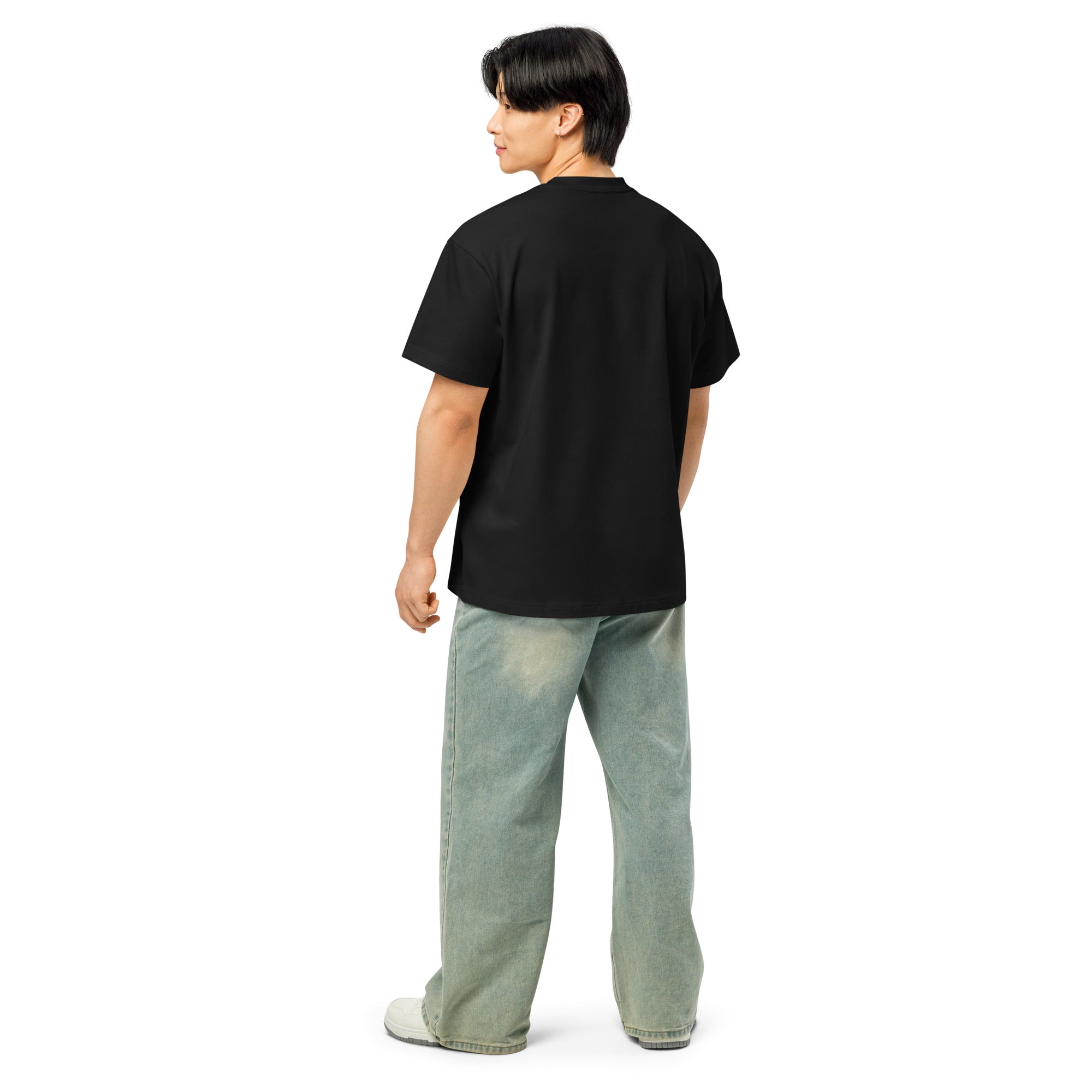 Person wearing a black t-shirt and light blue jeans on a white background at Oatmeal Apparel Co., for the 90's throwback collection.