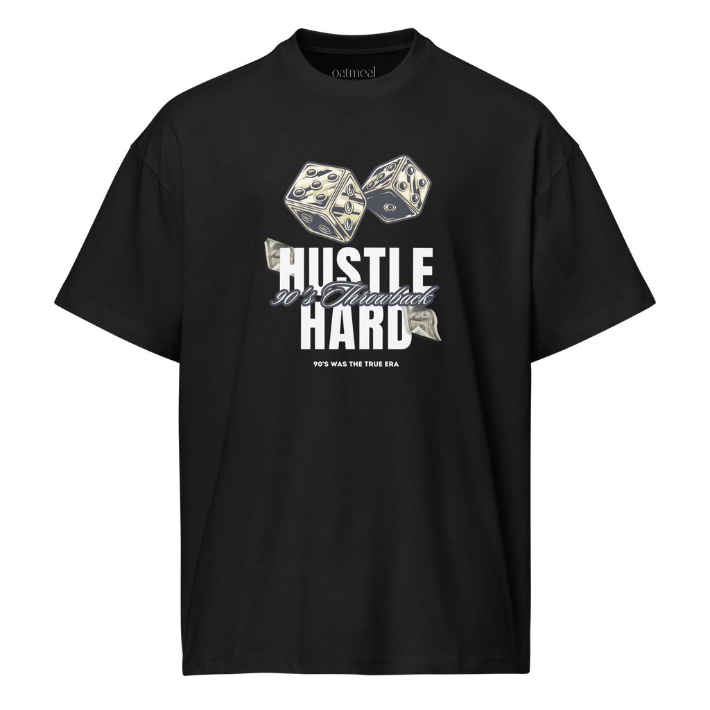 Black t-shirt with dice and 'HUSTLE HARD' text design on a white background at Oatmeal Apparel Co.