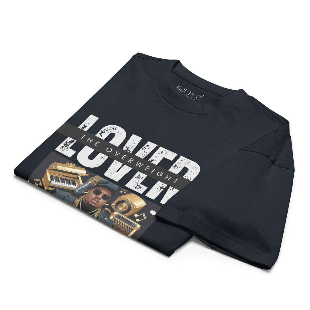 Folded Black men's box t-shirt with graphic design and text on a white background at Oatmeal Apparel Co.