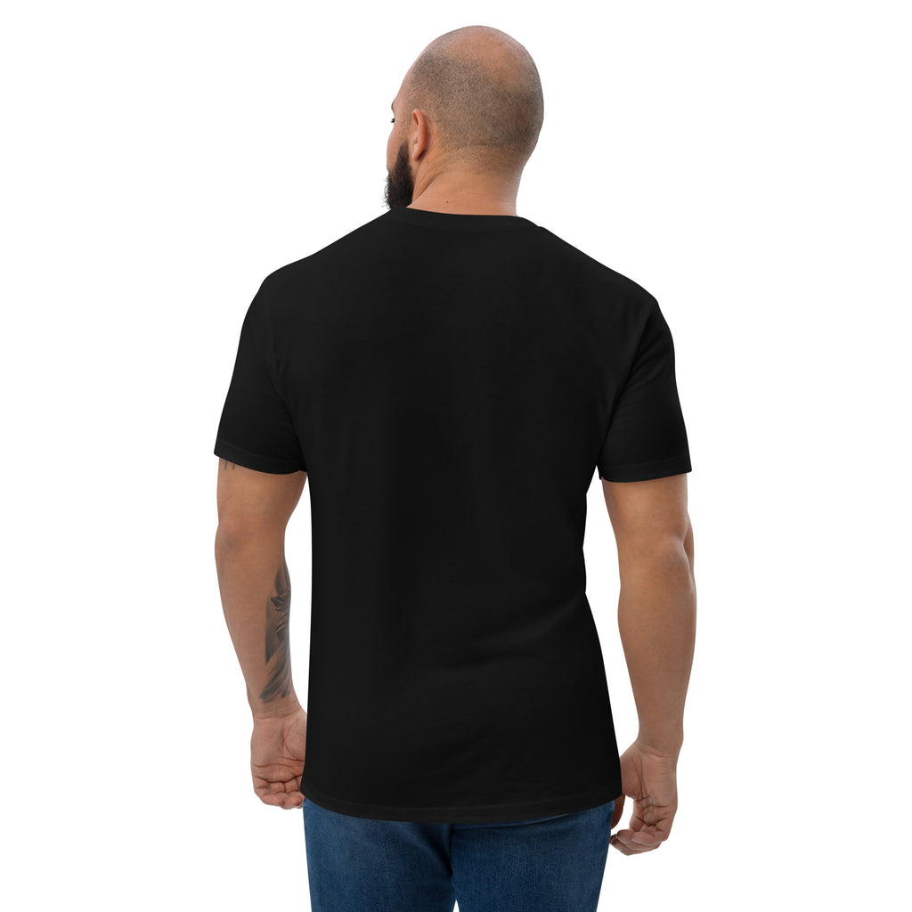 Man wearing a black t-shirt on a white background at Oatmeal Apparel Co.