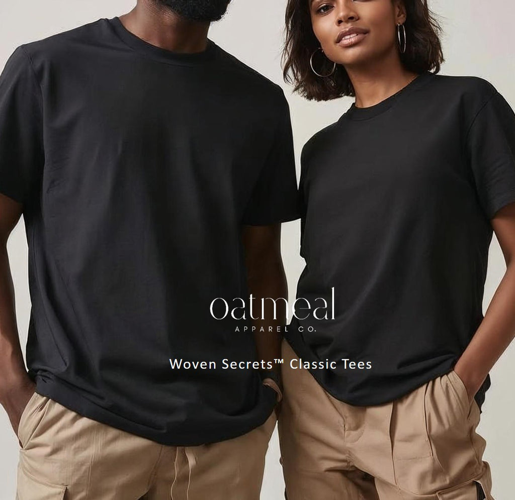 Two people wearing black t-shirts with 'Oatmeal Apparel Co.' branding on a neutral background.