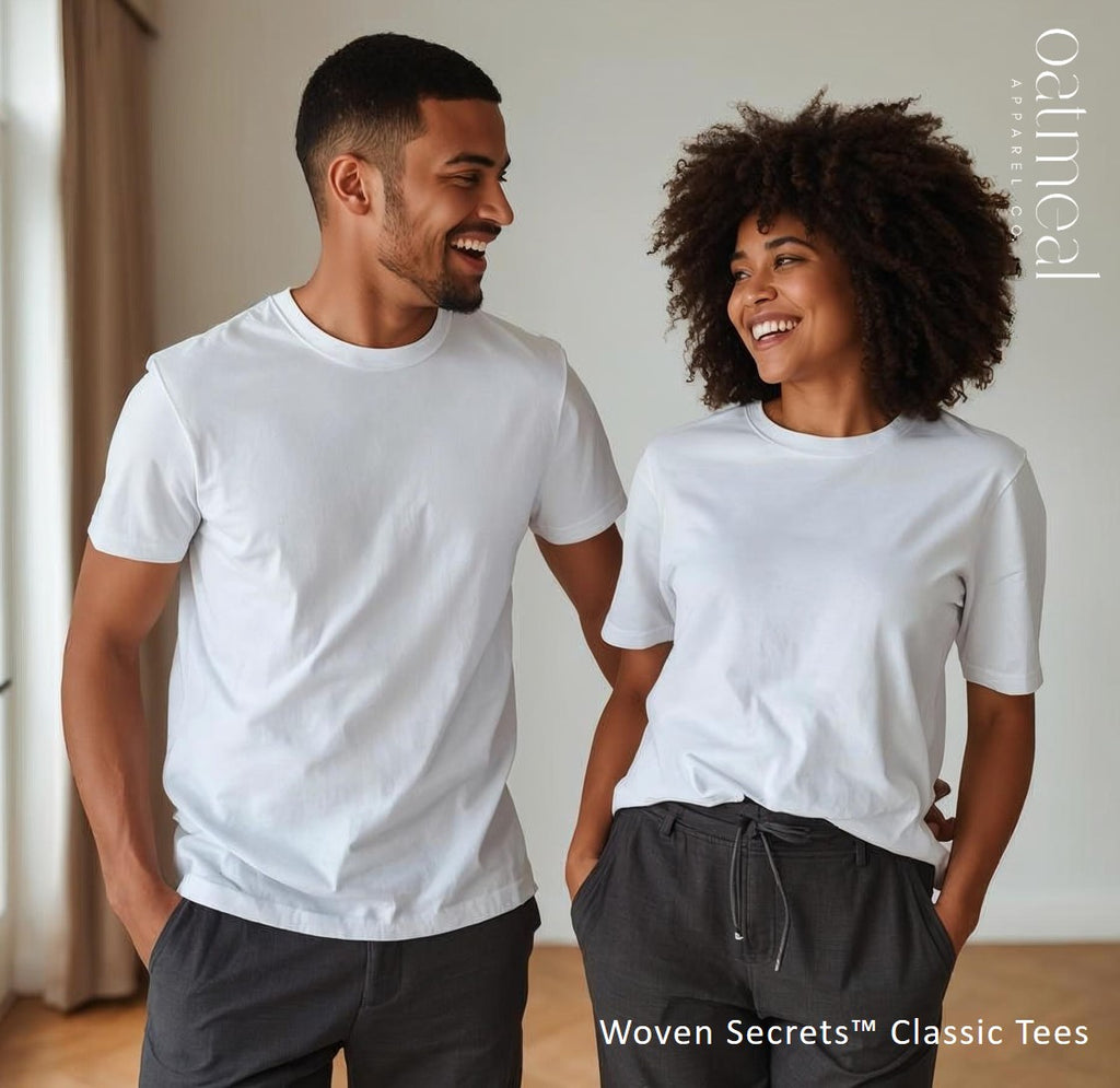 Two people wearing white t-shirts and dark pants standing indoors, from Woven Secrets Classic Tee at Oatmeal Apparel Co.