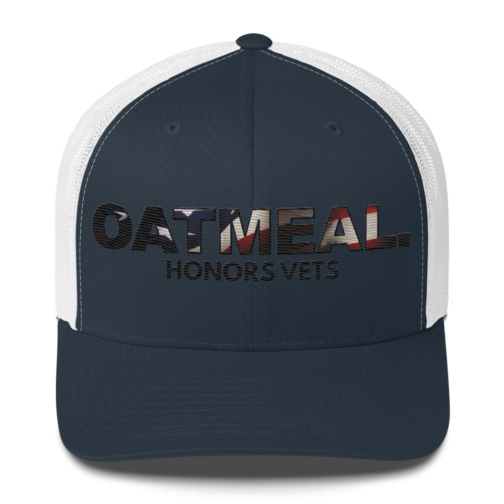 Navy and white cap with 'Oatmeal Honors Vets' text on a white background exclusively at Oatmeal Apparel Co.