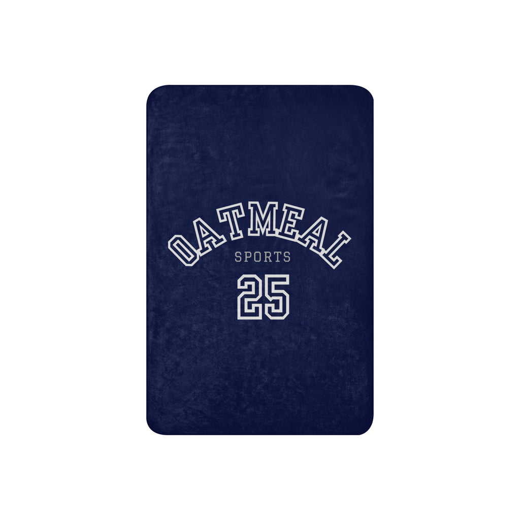 Navy blue blanket with 'Oatmeal Sports 25' text on a white background at Oatmeal Apparel Co.