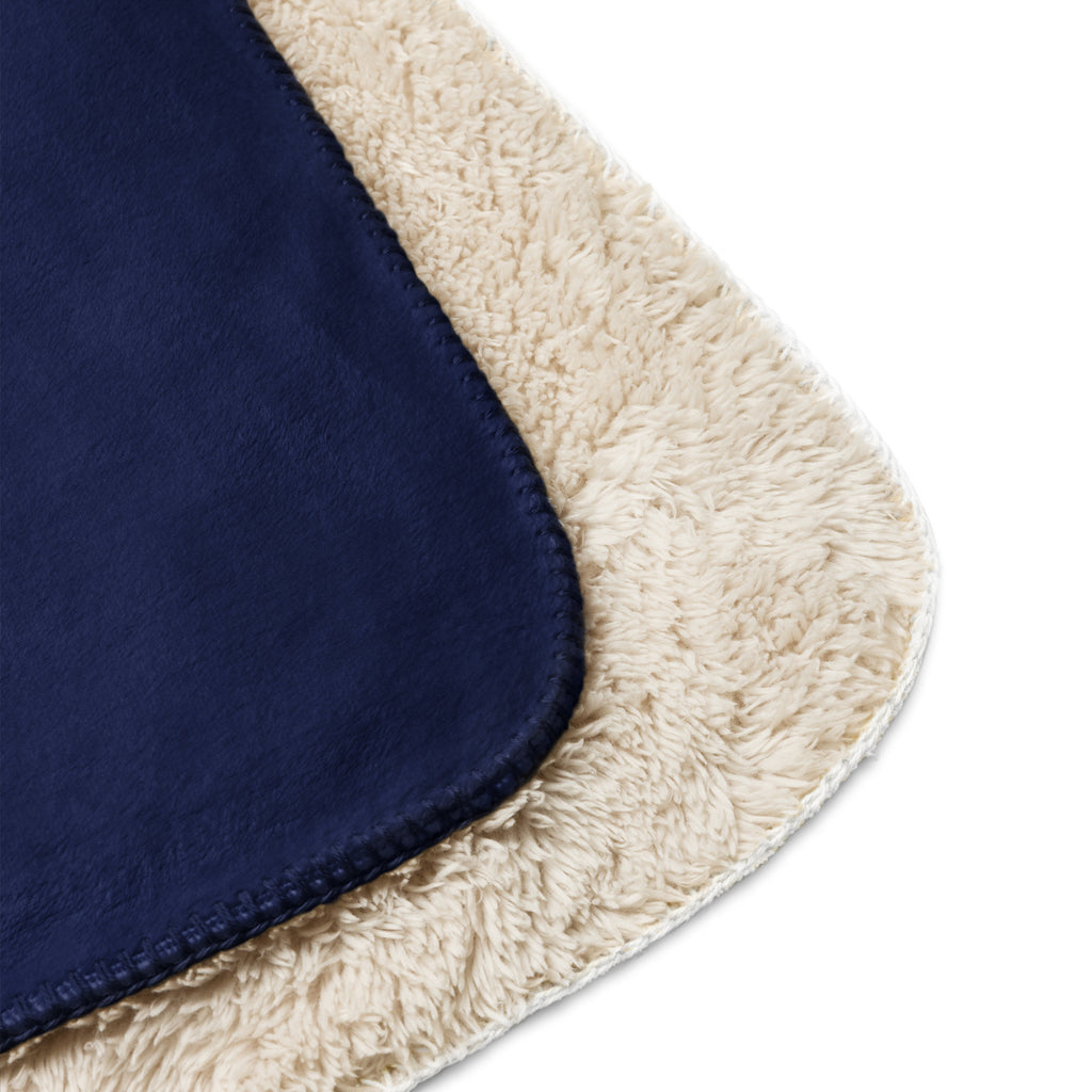 Navy blue fabric with plush beige fleece lining on a white background at Oatmeal Apparel Co.