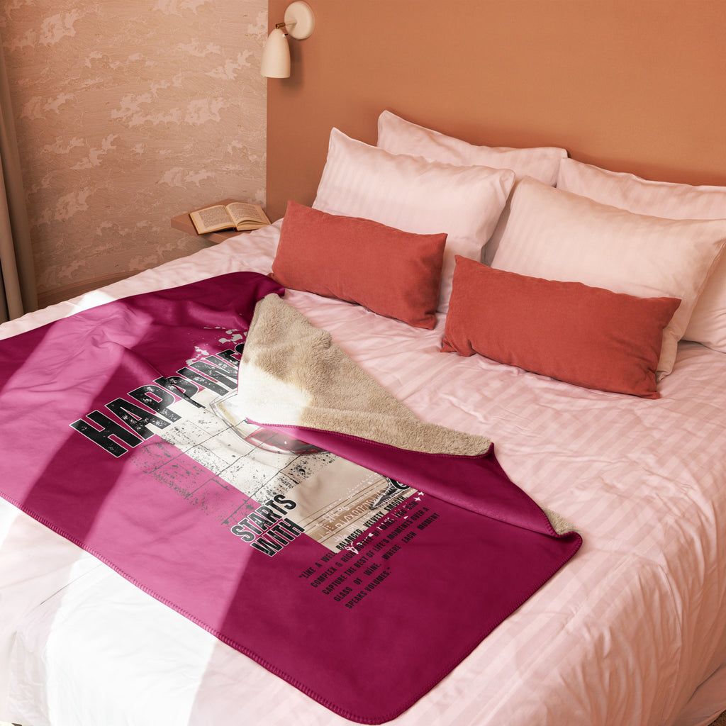 Bed with burgundy blanket featuring 'wine' text and graphics at Oatmeal Apparel Co.