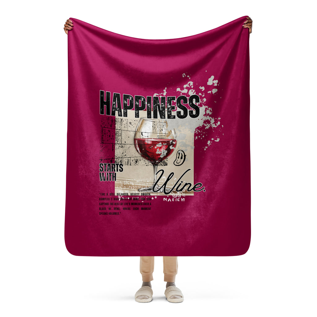 Person holding a magenta blanket with a wine-themed design and text at Oatmeal Apparel Co.