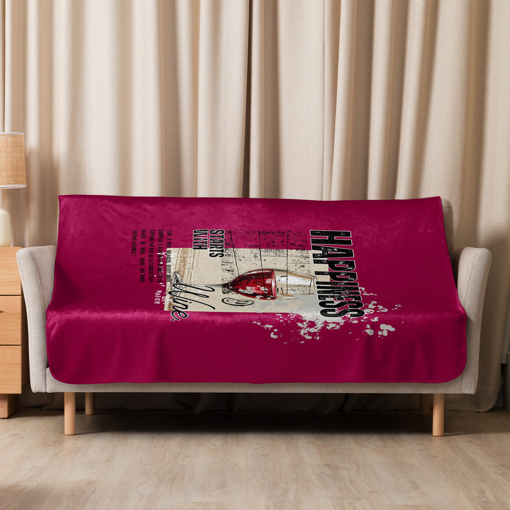 Sherpa blanket with wine-themed graphic design on a beige couch against a beige curtain background at Oatmeal Apparel Co.