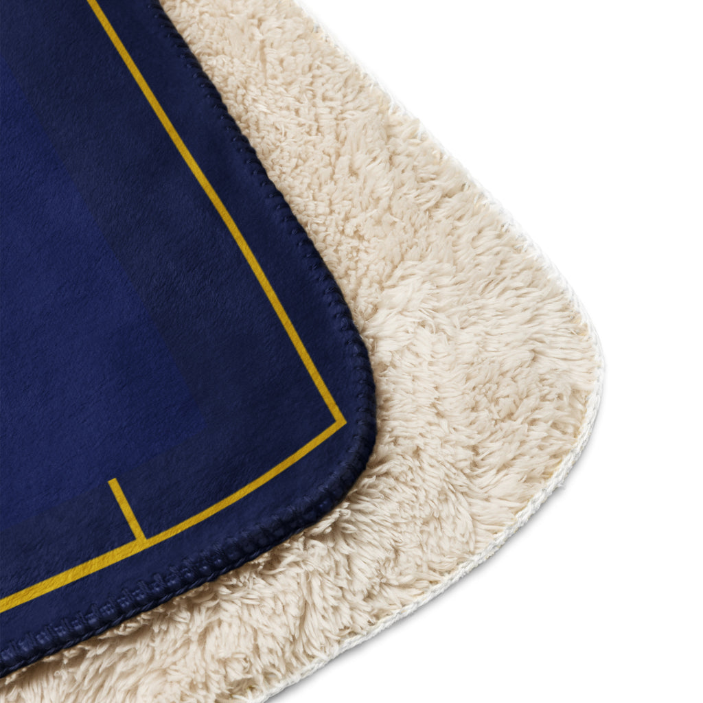 Navy blue fabric with gold trim on a beige border at Oatmeal Apparel Co.