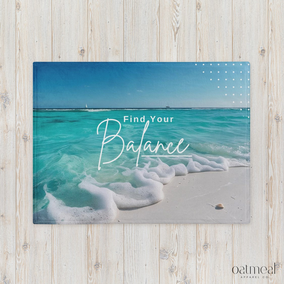 Beach scene with 'Find Your Balance' text on a wooden surface, Oatmeal brand visible at Oatmeal Apparel Co.