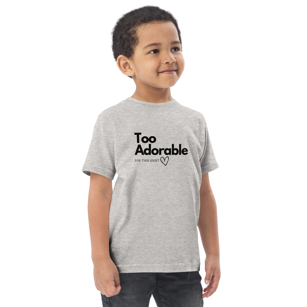 Child wearing a gray t-shirt with 'Too Adorable' text on a white background at Oatmeal Apparel Co.