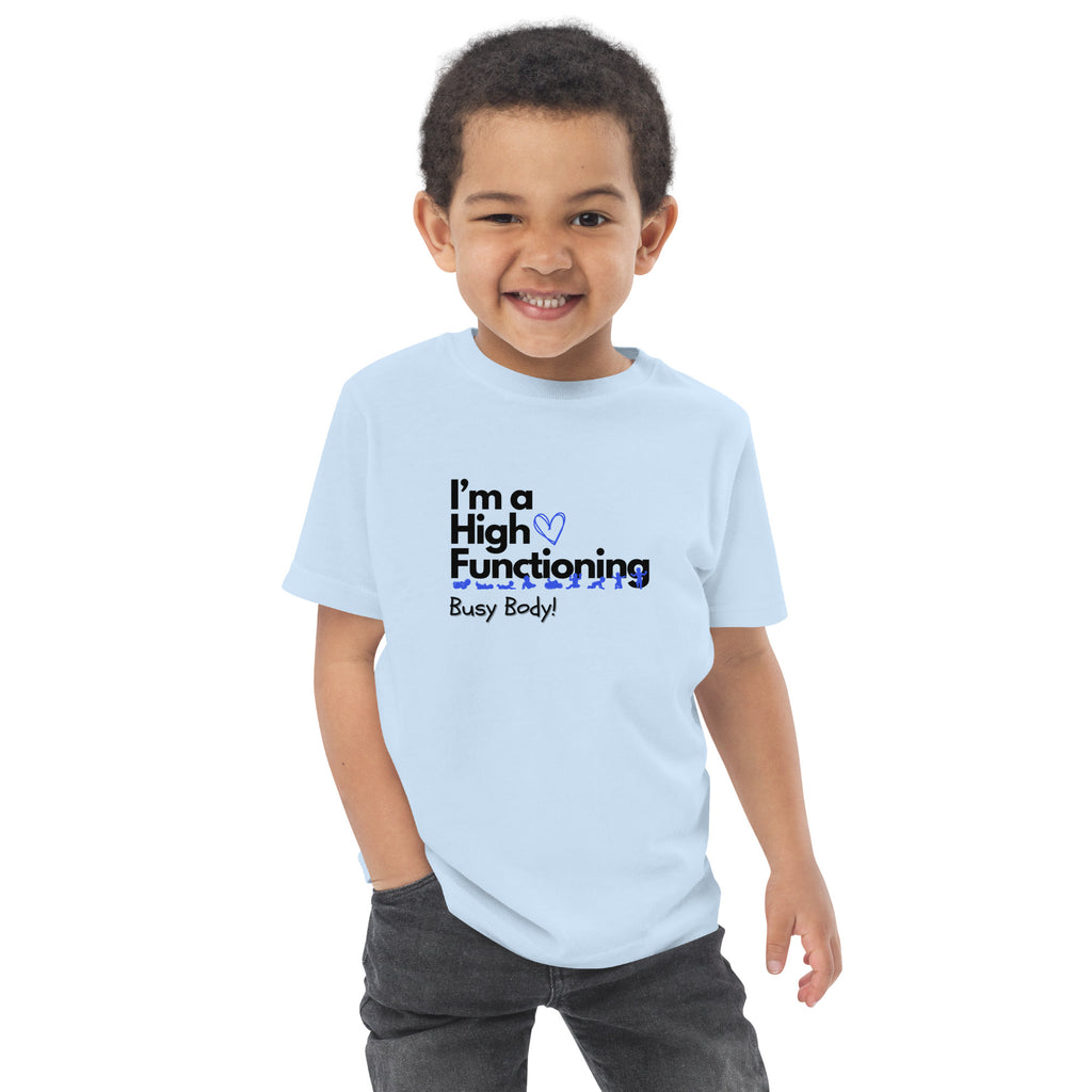 Child wearing a light blue t-shirt with 'High Functioning Busy Body' text on a white background at Oatmeal Apparel Co.