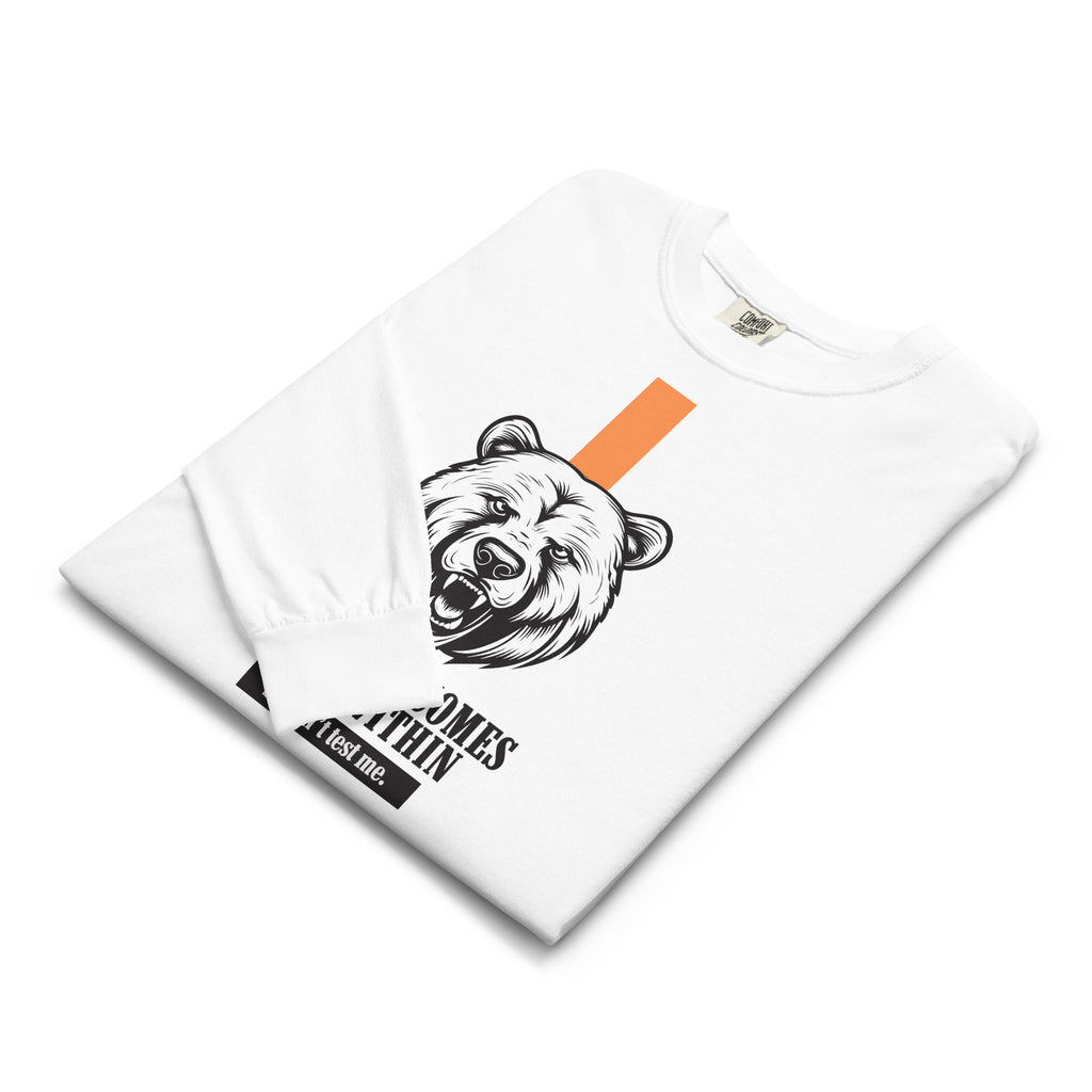 Folded White long-sleeve t-shirt with bear graphic and text on a white background at Oatmeal Apparel Co.