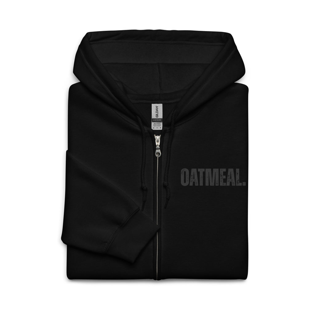 Folded Black hoodie with 'OATMEAL' branding on a white background at Oatmeal Apparel Co.