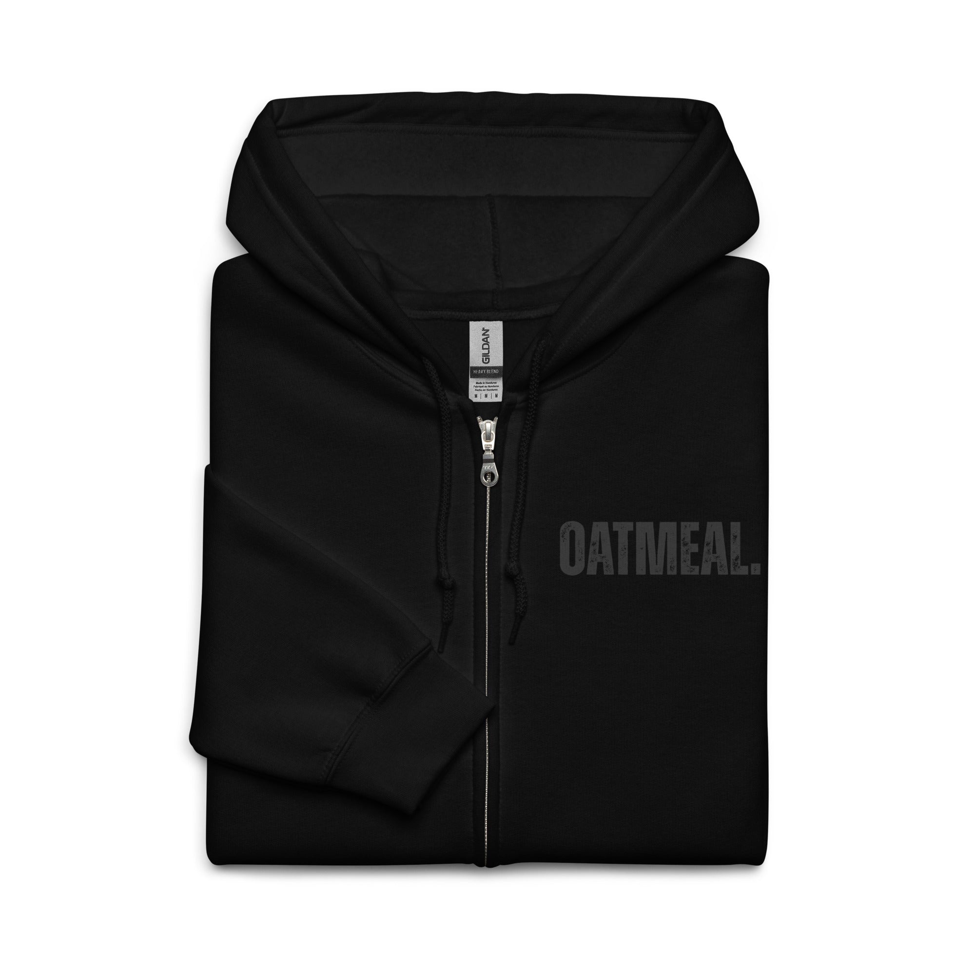 Folded Black hoodie with 'OATMEAL' branding on a white background at Oatmeal Apparel Co.