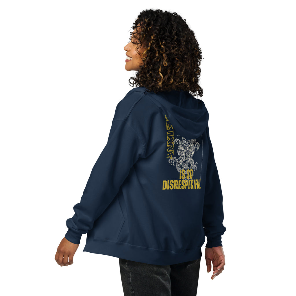Person wearing a navy hoodie with yellow text and dragon design on the back, on a white background at Oatmeal Apparel Co.