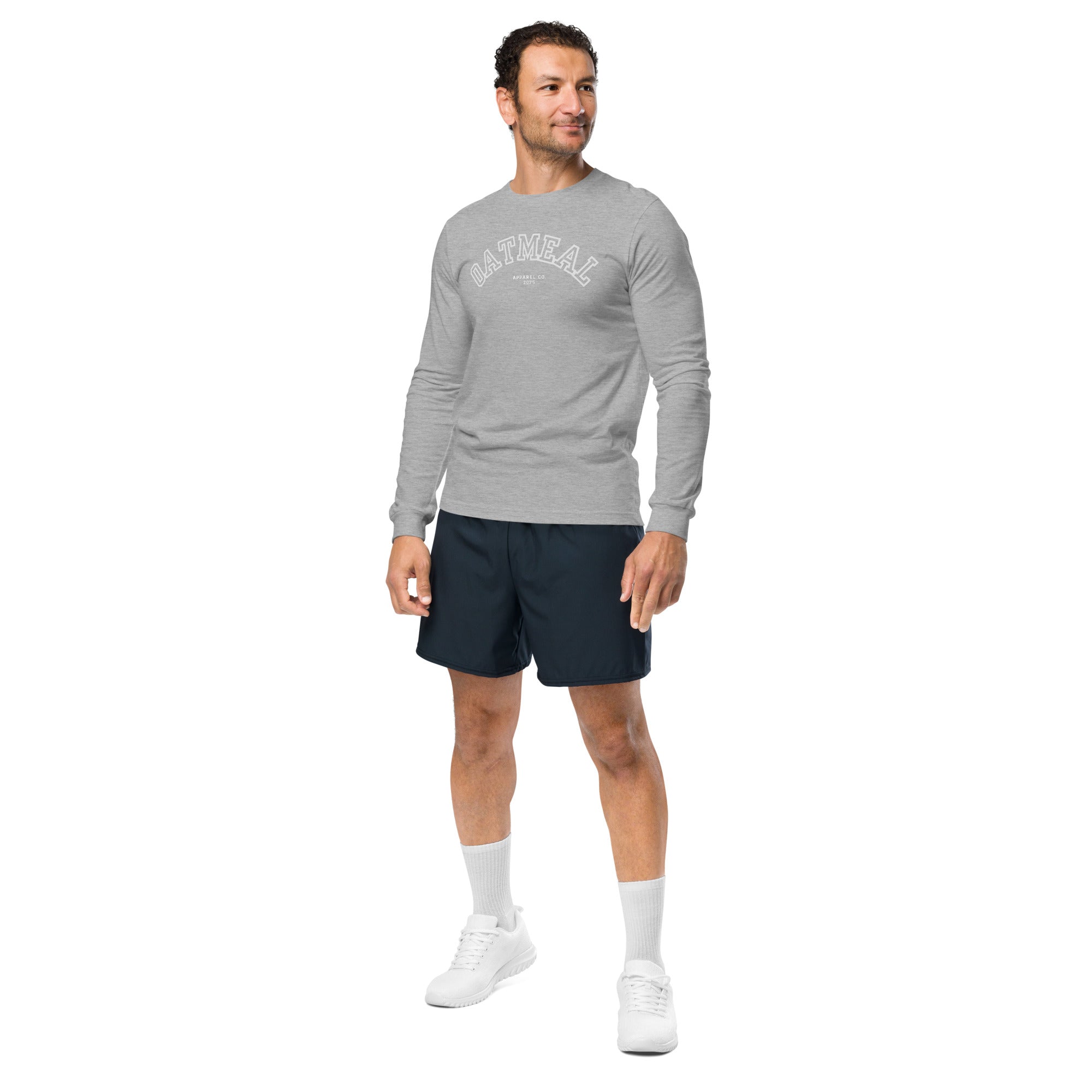 Man wearing a gray long-sleeve shirt and navy shorts on a white background at Oatmeal Apparel Co., Sports Edition Design.