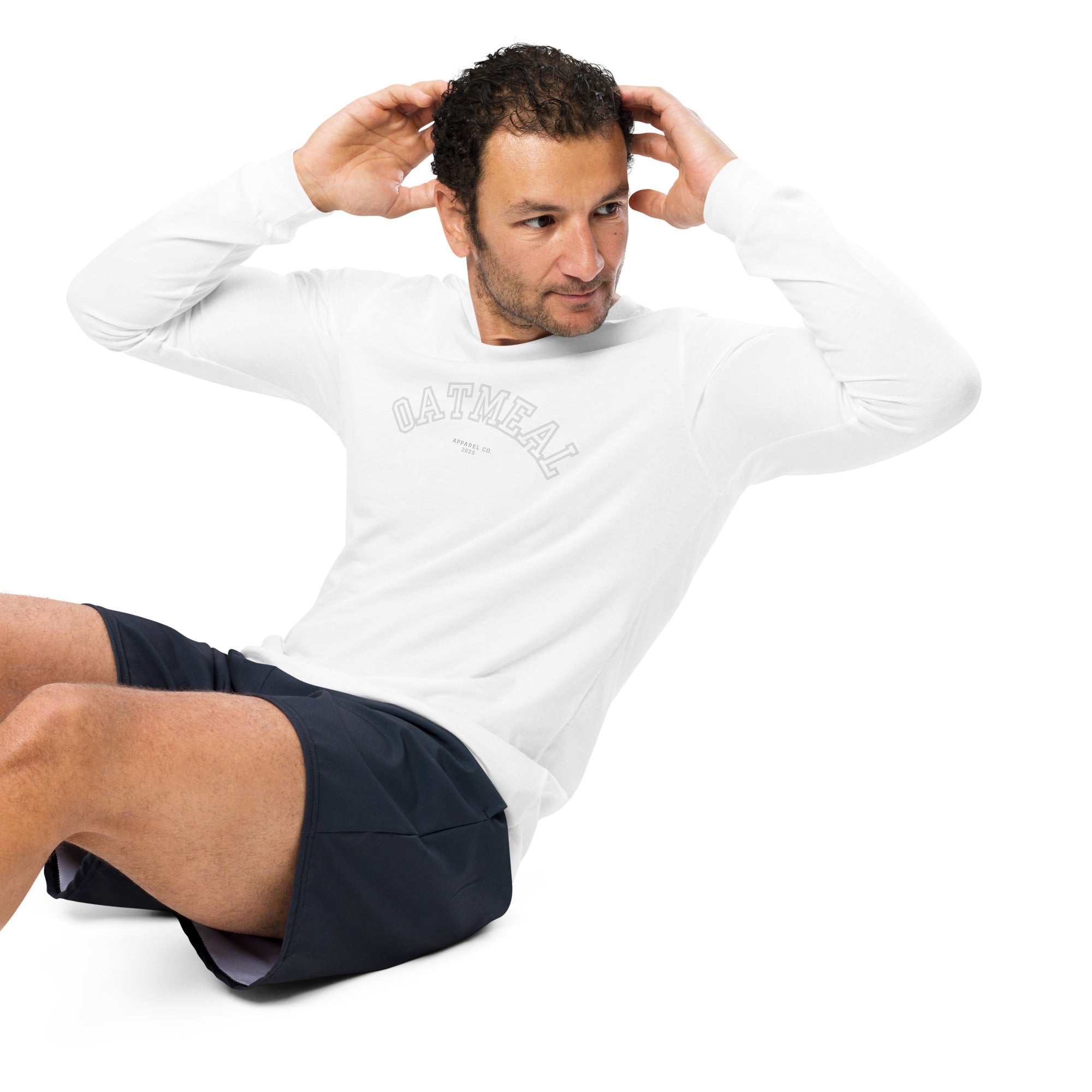 Man working out wearing a white long-sleeve shirt with 'oatmeal' branding at Oatmeal Apparel Co., Sports Edition Design.