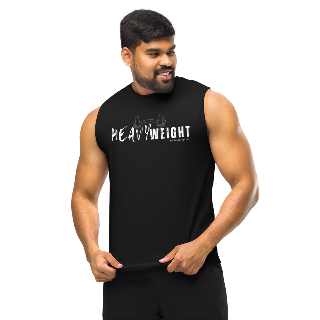 Man wearing a black sleeveless shirt with 'HEAVY WEIGHT' text on a white background at Oatmeal Apparel Co., Sports Edition Design.