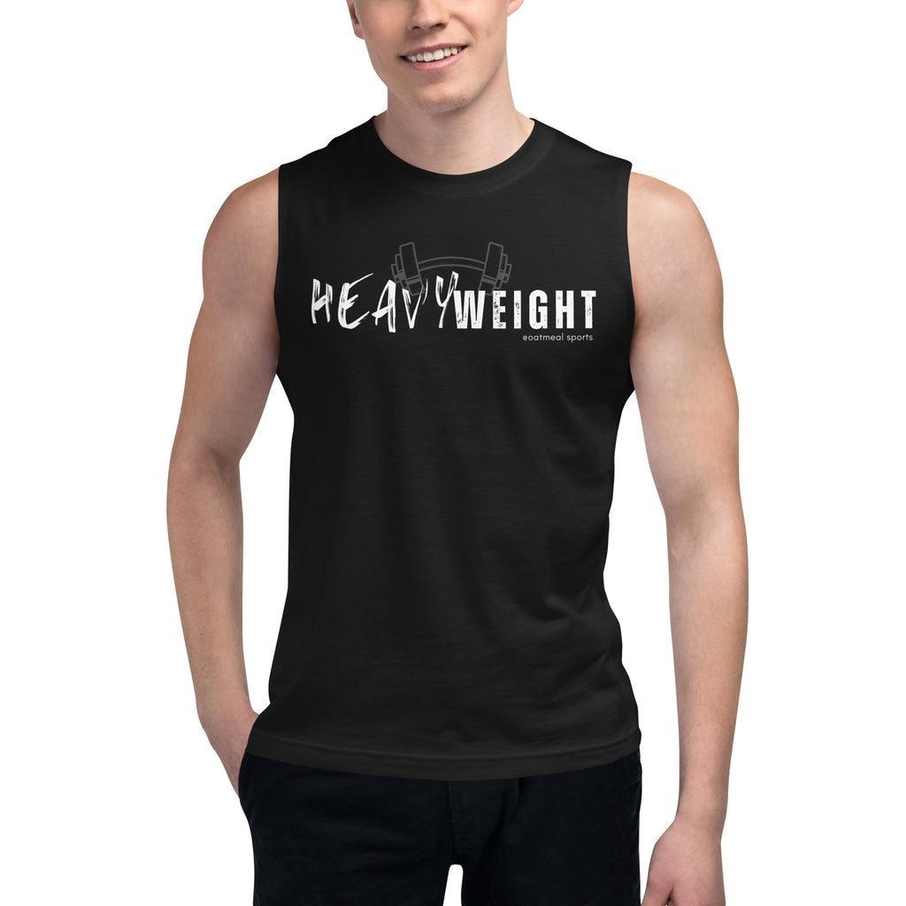Person wearing a black sleeveless shirt with 'HEAVYWEIGHT' text on a white background at Oatmeal Apparel Co., Sports Edition Design.