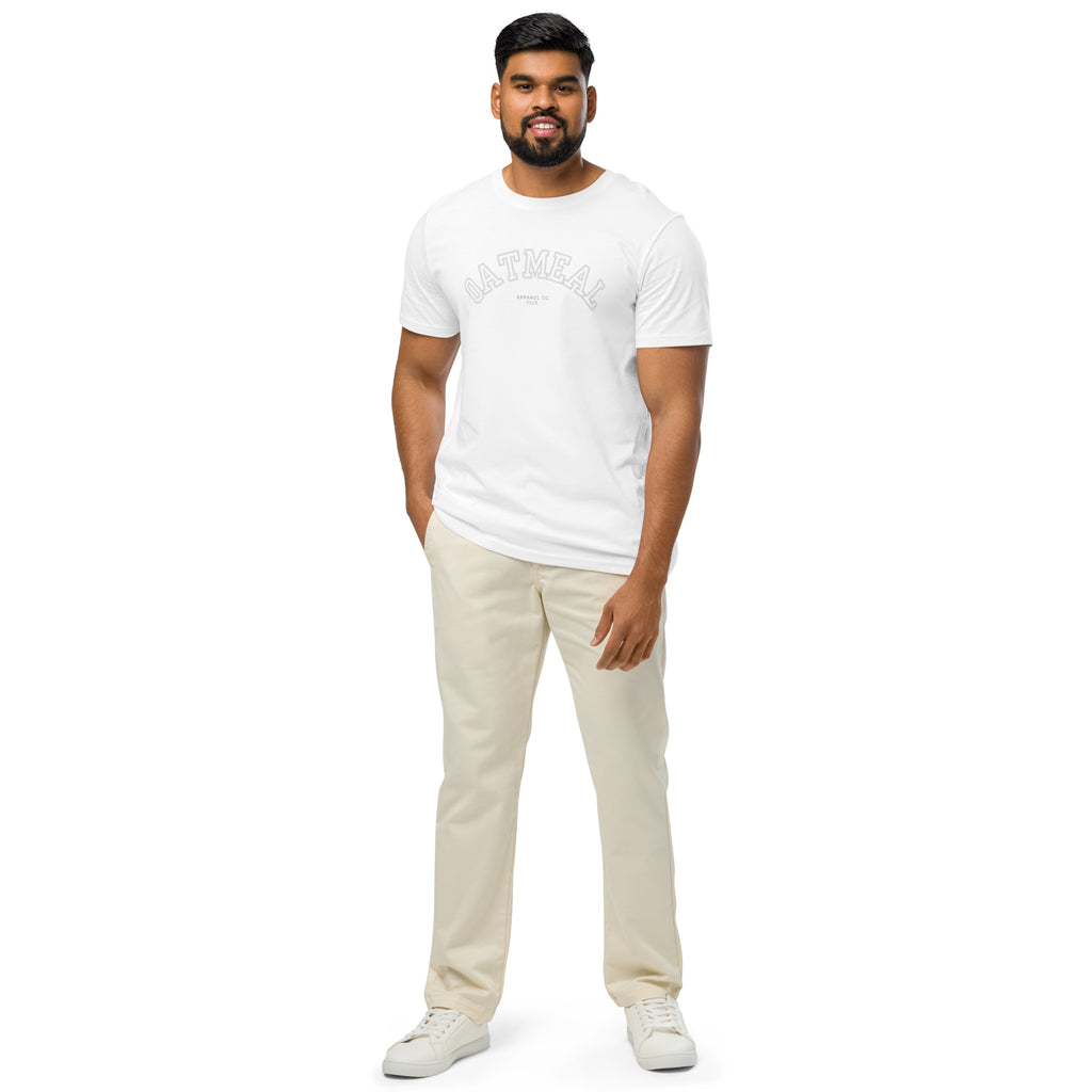 Man wearing a white t-shirt and beige pants on a white background at Oatmeal Apparel Co., sports inspired edition.