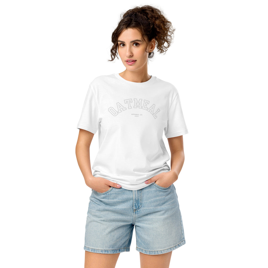 Woman wearing a white t-shirt with 'OATMEAL SPORTS' branding and light blue shorts at Oatmeal Apparel Co.
