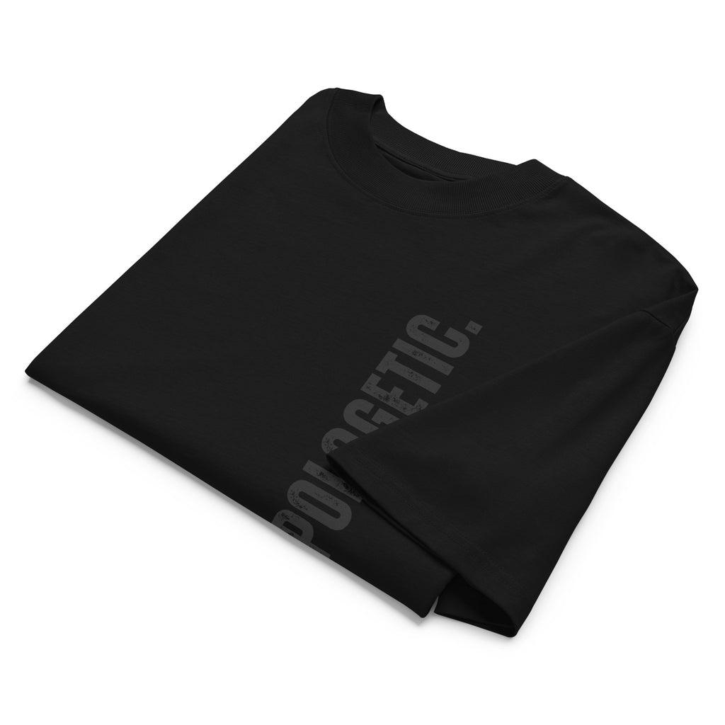 Black t-shirt with 'UPAPOLOGETIC' text on a white background at Oatmeal Apparel Co.