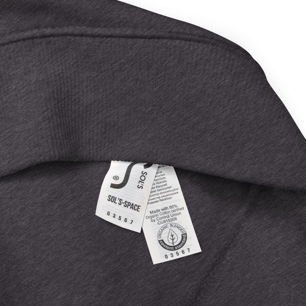 Close-up of a dark gray fabric with a certified organic cotton label on a white background at Oatmeal Apparel Co.