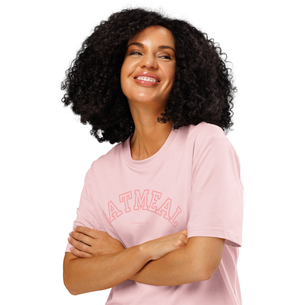 Woman wearing a pink t-shirt with 'OATMEAL' branding on a white background at Oatmeal Apparel Co., Sports Edition Design.