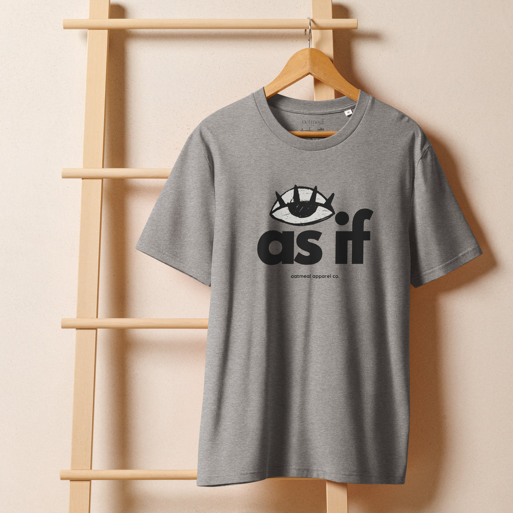 Gray t-shirt with 'as if' graphic on a wooden hanger against a beige wall at Oatmeal Apparel Co.