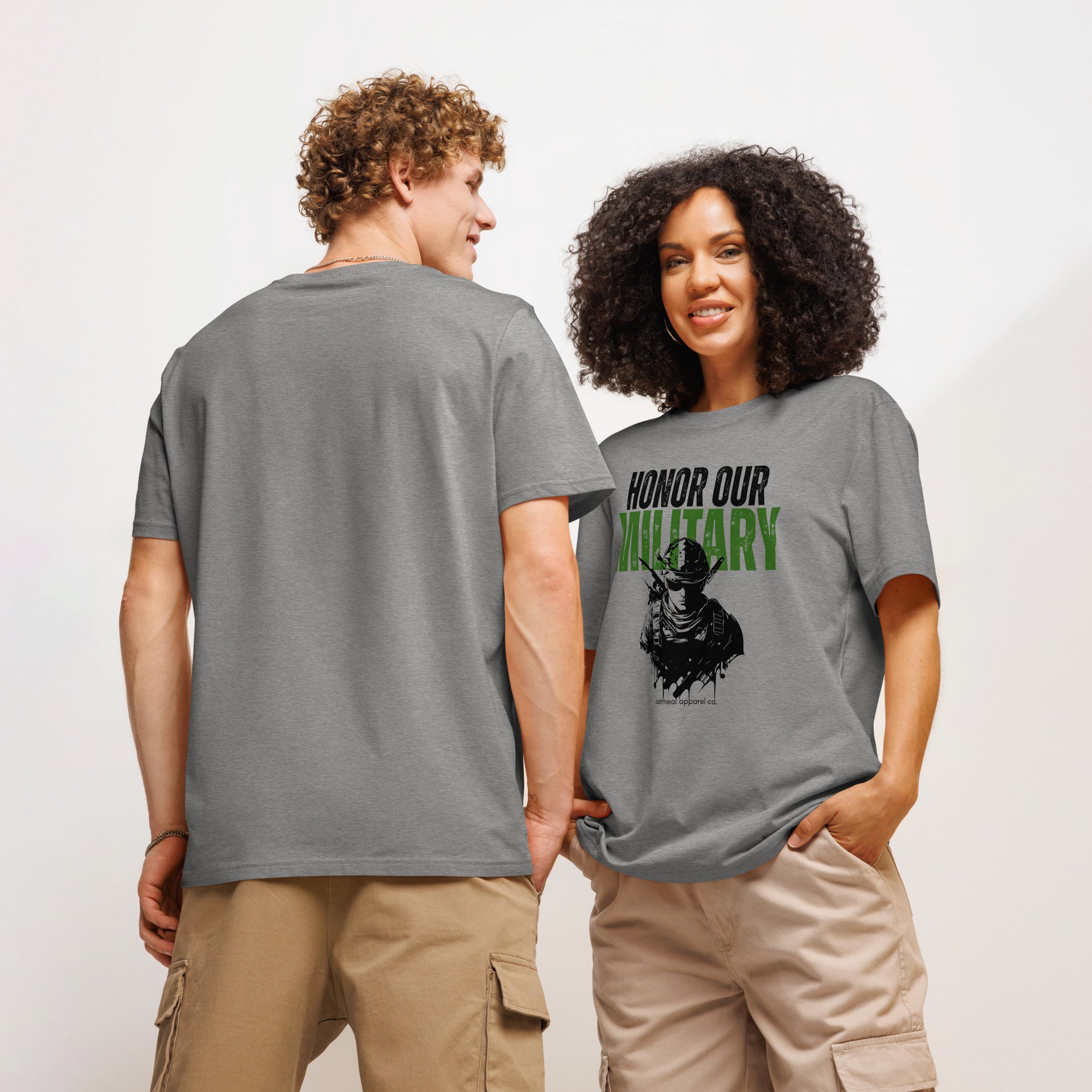 Two people wearing gray t-shirts with a graphic design and 'Honor Our Military' text on a plain background avail at Oatmeal Apparel Co.
