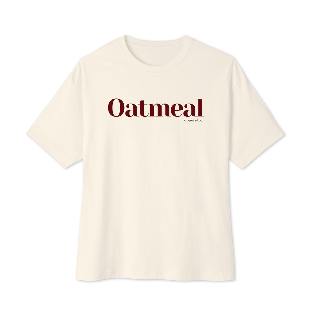 An natural-tan color short-sleeve crewneck t-shirt featuring the word 'Oatmeal' printed in a dark red serif font across the chest, with 'support co.' in smaller text underneath. Oatmeal Apparel Co.