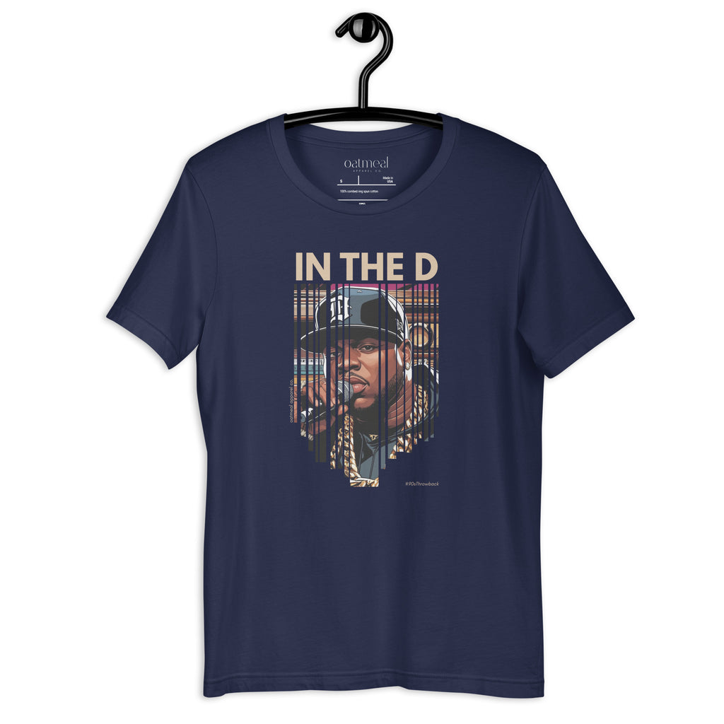 Navy blue t-shirt with custom graphic design and text 'IN THE D' on a hanger, at Oatmeal Apparel Co.