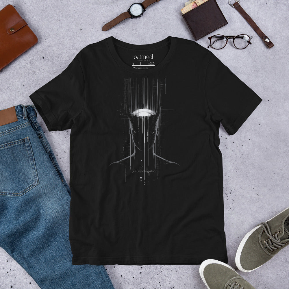 Black t-shirt with a graphic design on a concrete surface with jeans, shoes, and accessories at Oatmeal Apparel Co.