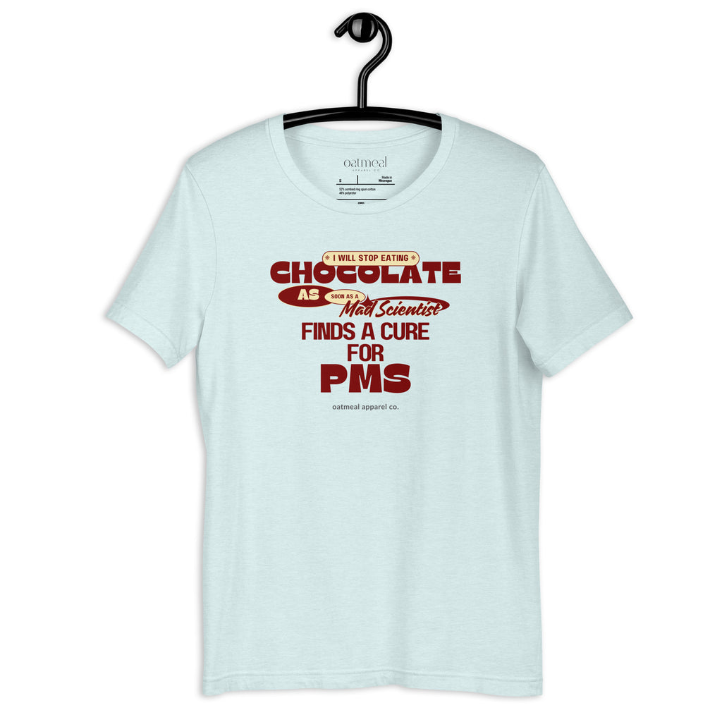 Light blue t-shirt with 'Chocolate & PMS' text on a hanger against a white background available at Oatmeal Apparel Co.