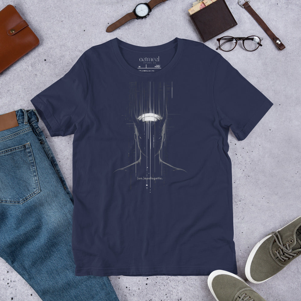 Navy blue t-shirt with a graphic design on a gray surface with jeans, shoes, and accessories at Oatmeal Apparel Co.