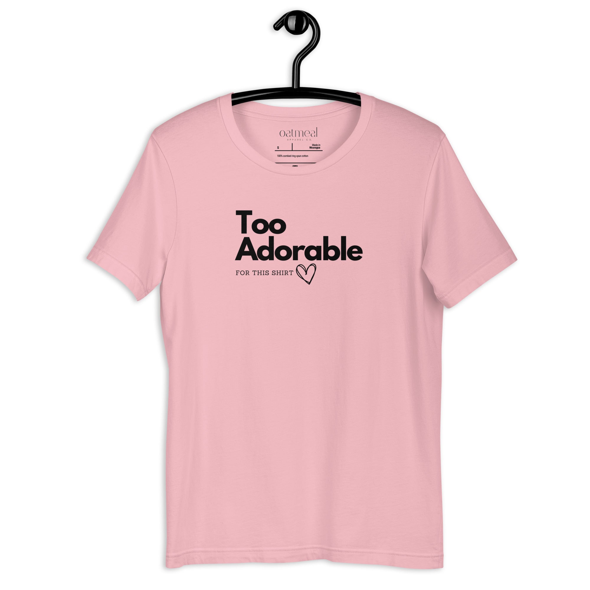 Adult Pink t-shirt with 'Too Adorable' text on a hanger against a white background available at Oatmeal Apparel Co.