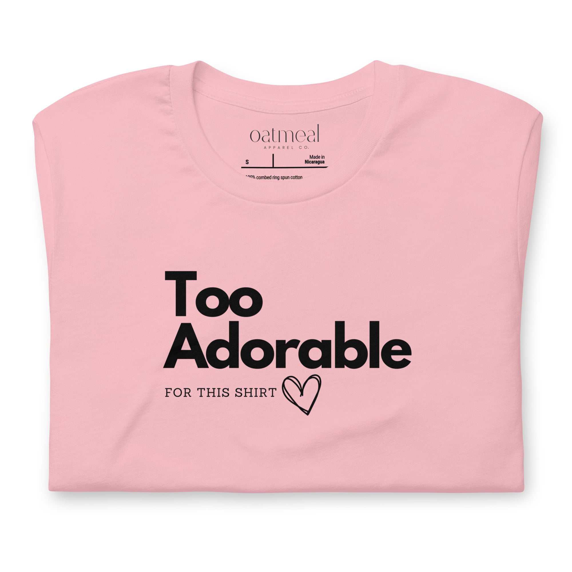 Pink t-shirt with 'Too Adorable for This Shirt' text on a white background available at Oatmeal Apparel Co.