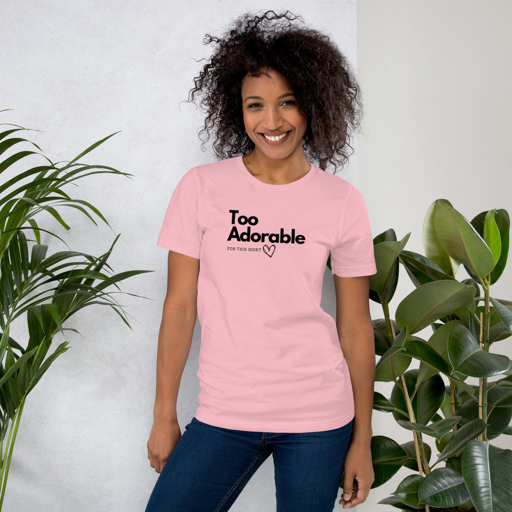 Woman wearing a pink t-shirt with 'Too Adorable' text, available at Oatmeal Apparel Co.