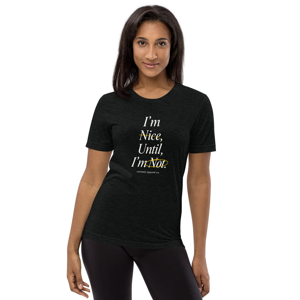 Woman wearing a black t-shirt with text at Oatmeal Apparel Co.