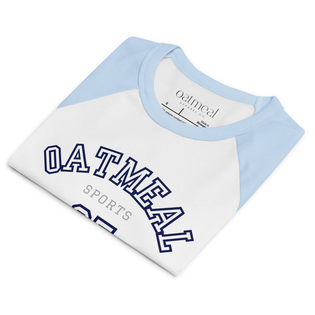 Folded White and light blue baseball shirt with 'OATMEAL' branding on a white background at Oatmeal Apparel Co.